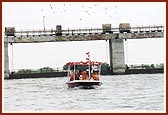 Swamishri, together with Shri Harikrishna Maharaj and Shri Ganapatiji sail in the river. 