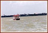 Swamishri, together with Shri Harikrishna Maharaj and Shri Ganapatiji sail in the river. 