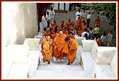 Swamishri being taken up the mandir steps
