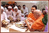 Swamishri takes prasad from various mandirs during lunch