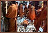 Sadhus prostrate before the deities during Mangala arti