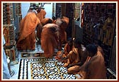 Sadhus prostrate before the deities during Mangala arti