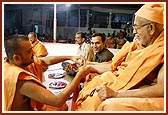 Tying nada chhadi on Balmukund Swami's wrist
