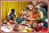 Swamishri bathes deities with water