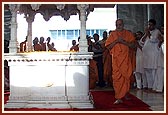 Swamishri doing darshan and circumambulating the shrine at Yogi Smruti Mandir