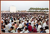 Devotees take thier seats prior to the start of the celebration program