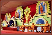 Swamishri on stage with the senior sadhus