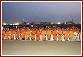 Devotees and sadhus engrossed in watching the enlightening and entertaining birthday celebration program