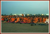 Devotees and sadhus engrossed in watching the enlightening and entertaining birthday celebration program