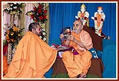 Swamishri inaugurates a new print publication, 'Karma Siddhant and Punarjanma', published by Swaminarayan Aksharpith