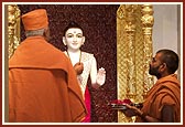 Pujya Doctor Swami engaged in the pratishtha rituals of Shri Ghanshyam Maharaj