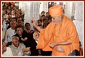 ... and bless the devotees by showering rice grains