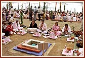 Devotees perform yagna rituals