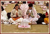 Devotees perform yagna rituals