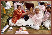 Devotees perform yagna rituals