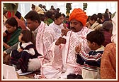 Devotees perform yagna rituals