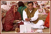 Devotees perform yagna rituals