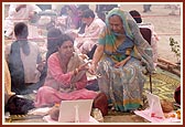 Devotees perform arti