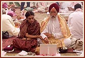 Devotees perform arti