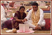 Devotees perform arti