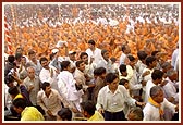 Swamishri drenches the joyous devotees in a shower of holy, colored water