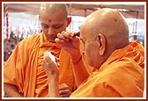 Swamishri applies the tilak and chandlo 