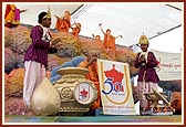 Balaks present an auspicious kumbha to Swamishri who then launches the Golden Jubilee Celebration