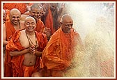 Swamishri directs the water spray on senior sadhus