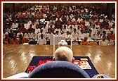 Swamishri's puja with Shri Harikrishna Maharaj placed on a decorated swing