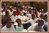 Kishores and kishoris seated in the auditorium