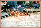 BAPS sadhus take a holy dip in the sacred waters
