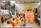 Pujya Doctor Swami serves mahaprasad to sadhus and pilgrims at the BAPS mandir in Nasik