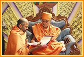 Swamishri writes his blessings in the mandir account book