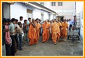 Swamishri on his way to see Annakut preparations