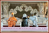 Swamishri and President with Shri Harikrishna Maharaj (center) on stage