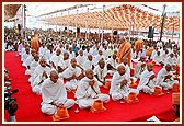 Pujya Mahant Swami, together with the parshads and sadhaks, perform the diksha mahapuja ceremony