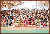 The mothers of the new sadhus and parshads participate in the mahapuja ceremony