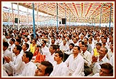 Devotees seated in the assembly during the diksha ceremony
