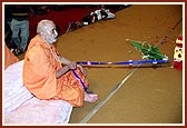 Swamishri rocks Shri Harikrishna Maharaj in the cradle to celebrate the birth of Bhagwan Swaminarayan
