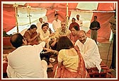 Devotees participating in the yagna rituals