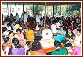 Devotees participating in the yagna rituals