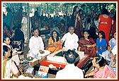 Devotees participating in the yagna rituals