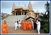 After Thakorji's darshan Swamishri is on his way towards the mandir assembly hall for his morning puja