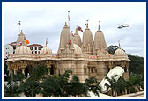 Shri Harikrishna Maharaj blesses the Bhakti Yatra procession during a helicopter trip