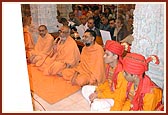 Sadhus and devotees celebrate the annakut of vegetables