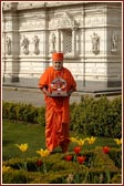 Harikrishna Maharaj and Swamishri in the colourful garden adjoining the Mandir