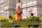 Harikrishna Maharaj and Swamishri in the colourful garden adjoining the Mandir