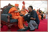 Swamishri sanctifies the Sponsored Walk T-shirts and caps