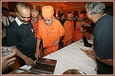 Swamishri views the certificate printing area