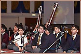 Students play and sing with great devotion and proficiency